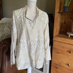 Beige colored jacket with shell beads